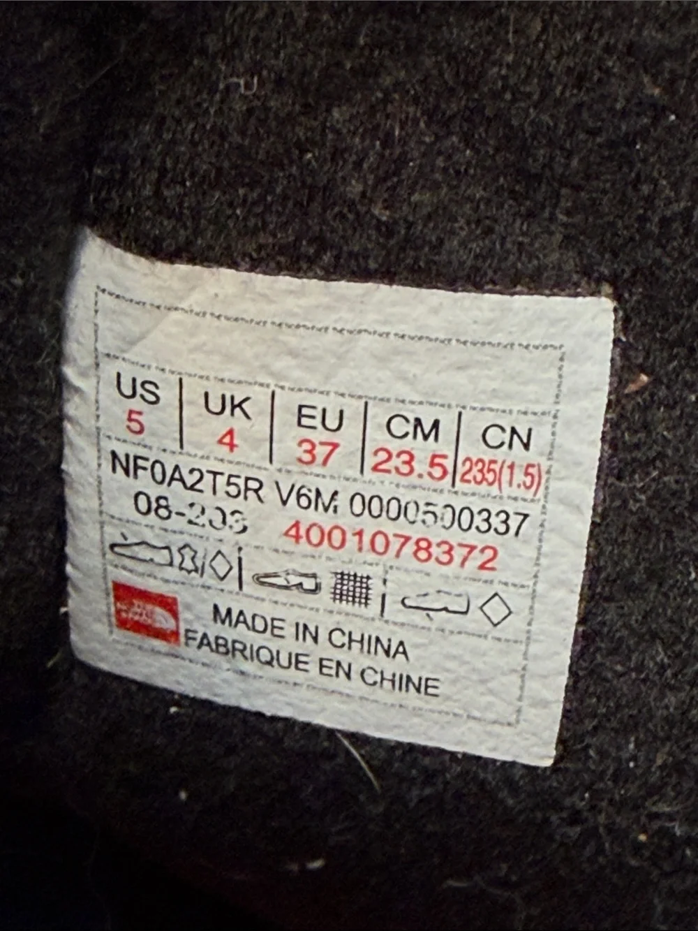 The North Face Kids Brown and Black Winter Boots with Orange Laces